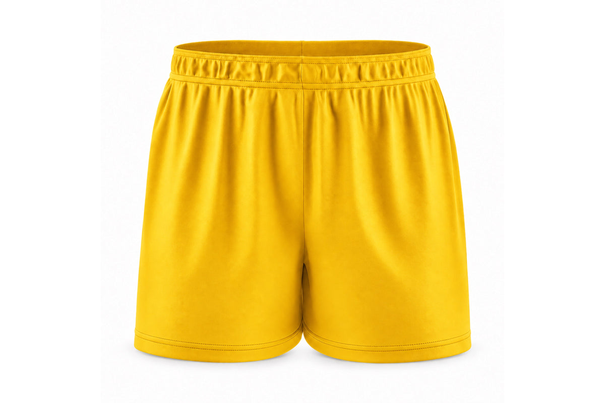 Front view of blank athletic gold custom sublimated athletic shorts with elastic waistband and stitched hems on a white background.