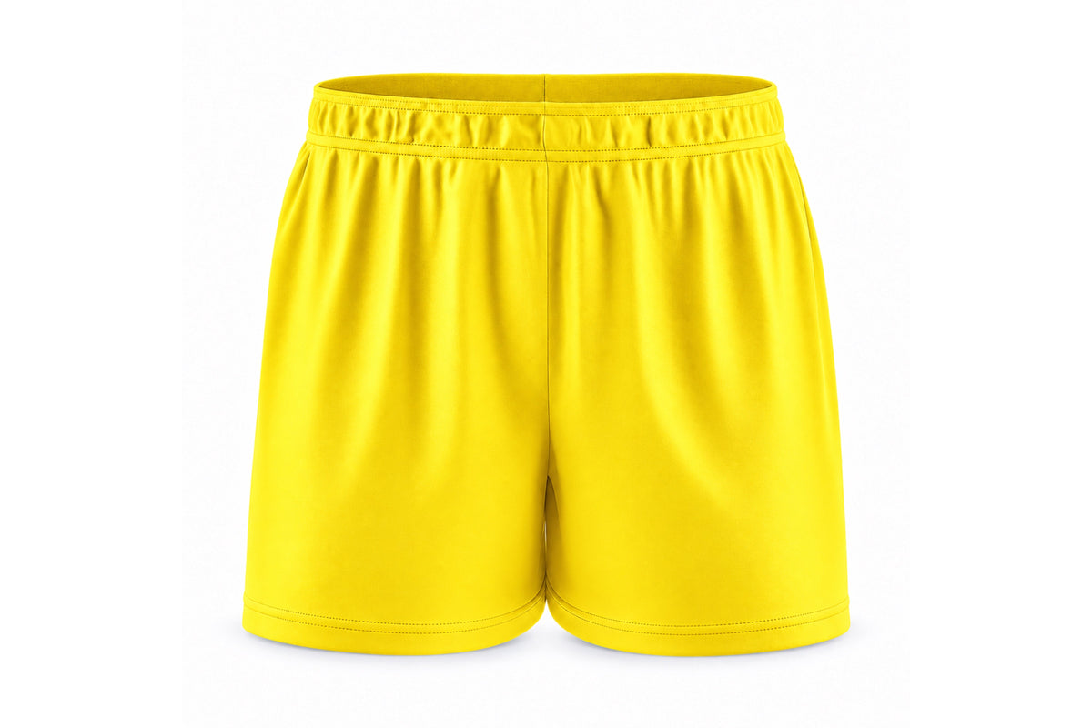 Front view of blank bright yellow custom sublimated athletic shorts with elastic waistband and stitched hems on a white background.