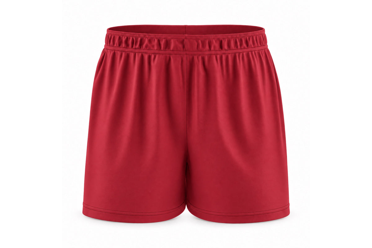 Front view of blank cardinal red custom sublimated athletic shorts with elastic waistband and stitched hems on a white background.