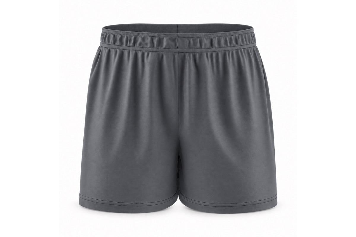 Front view of blank charcoal custom sublimated athletic shorts with elastic waistband and stitched hems on a white background.
