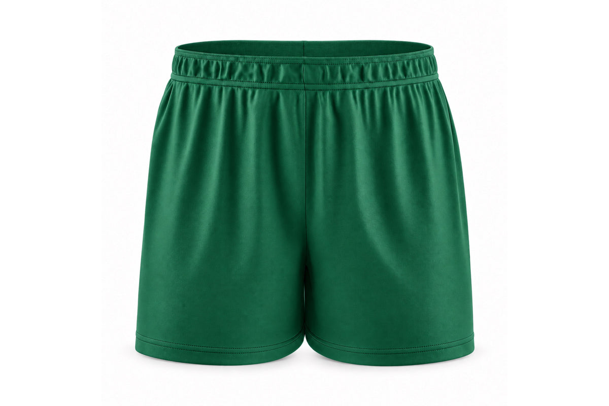 Front view of blank forest green custom sublimated athletic shorts with elastic waistband and stitched hems on a white background.