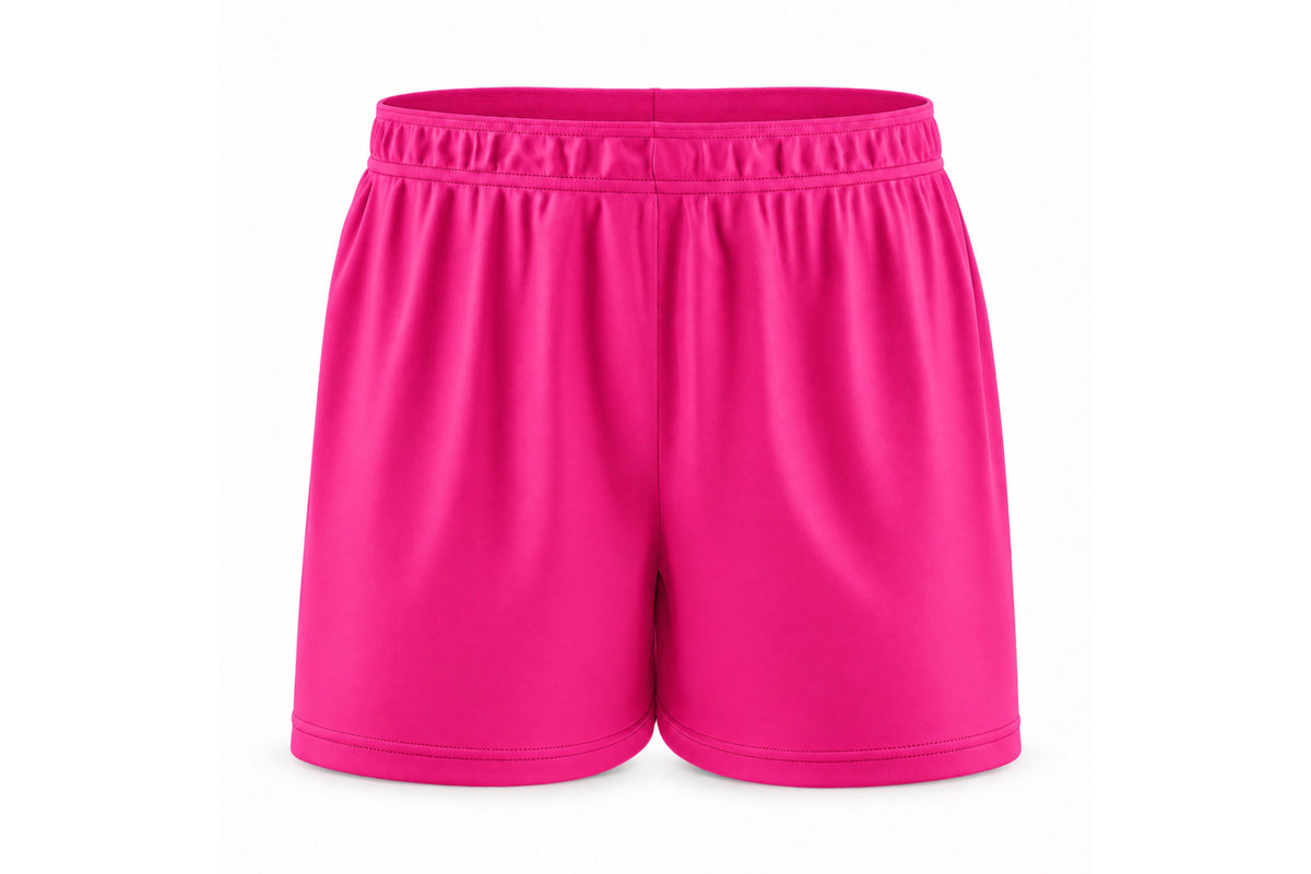Front view of blank hot pink custom sublimated athletic shorts with elastic waistband and stitched hems on a white background.