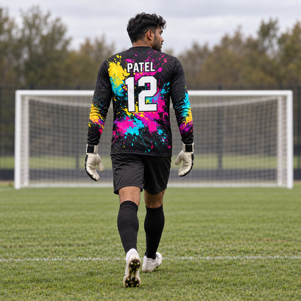 Neon Chaos custom goalkeeper jersey worn by male goalkeeper, full back view, PATEL 12