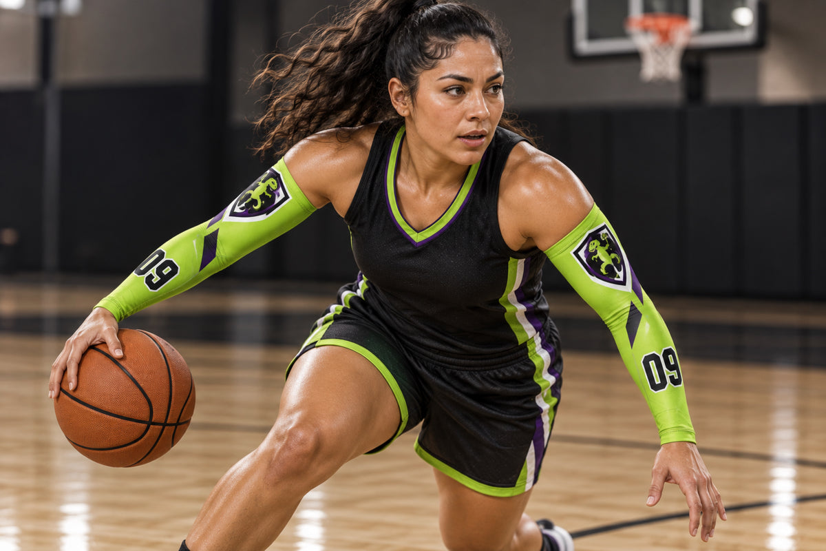 Basketball guard changing direction with the ball in Lime Green custom arm sleeves with a gecko crest and number 09