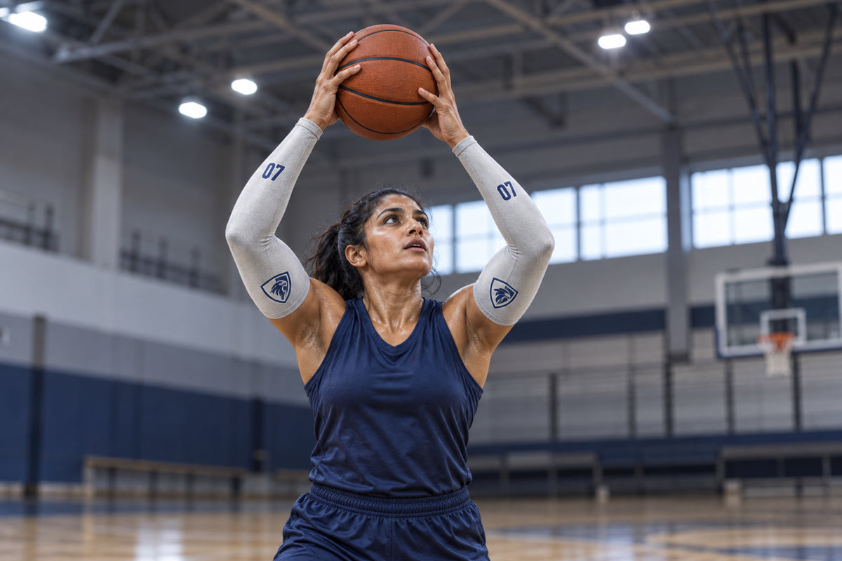 Basketball player reaching for a rebound in Silver Gray custom arm sleeves with a falcon crest and number 07
