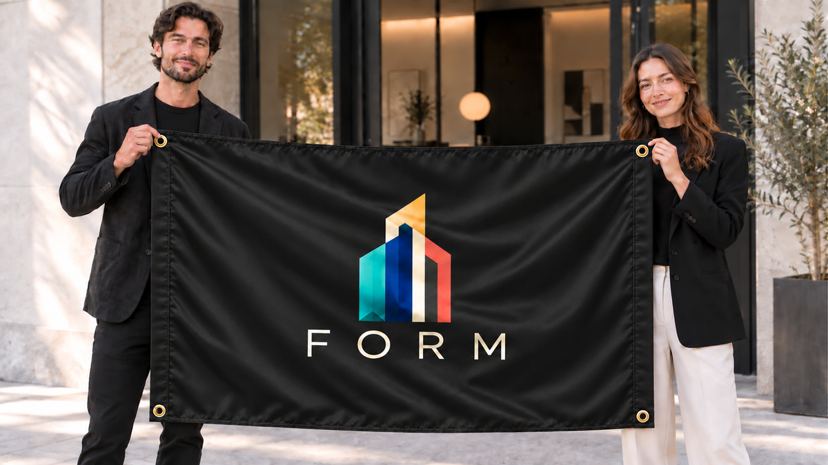 Illustrative campaign: FORM design studio founders with a richly customized Black flag, 5 feet wide by 3 feet tall, four metal corner grommets and reinforced side bands.