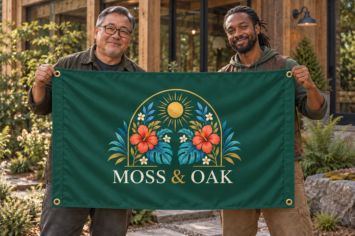 Illustrative campaign: adult business owners outside their workplace holding a customized forest green flag, 5 feet wide by 3 feet tall with vivid multicolor artwork and four corner grommets