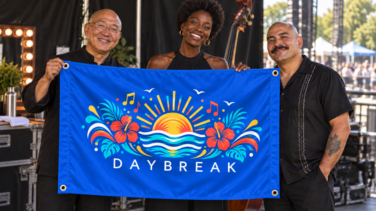 Royal Blue customized 5 ft x 3 ft flag at a music event, with colorful original artwork, people, four corner grommets and matching stitched side bands