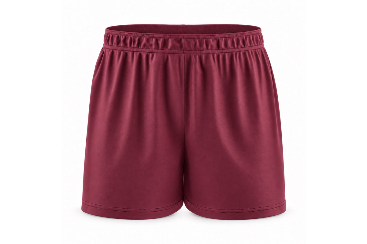 Front view of blank maroon custom sublimated athletic shorts with elastic waistband and stitched hems on a white background.