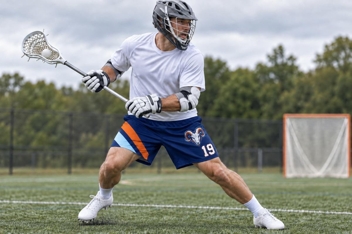 Lacrosse player executing a split dodge on an outdoor field wearing navy custom sublimated athletic shorts with number 19.