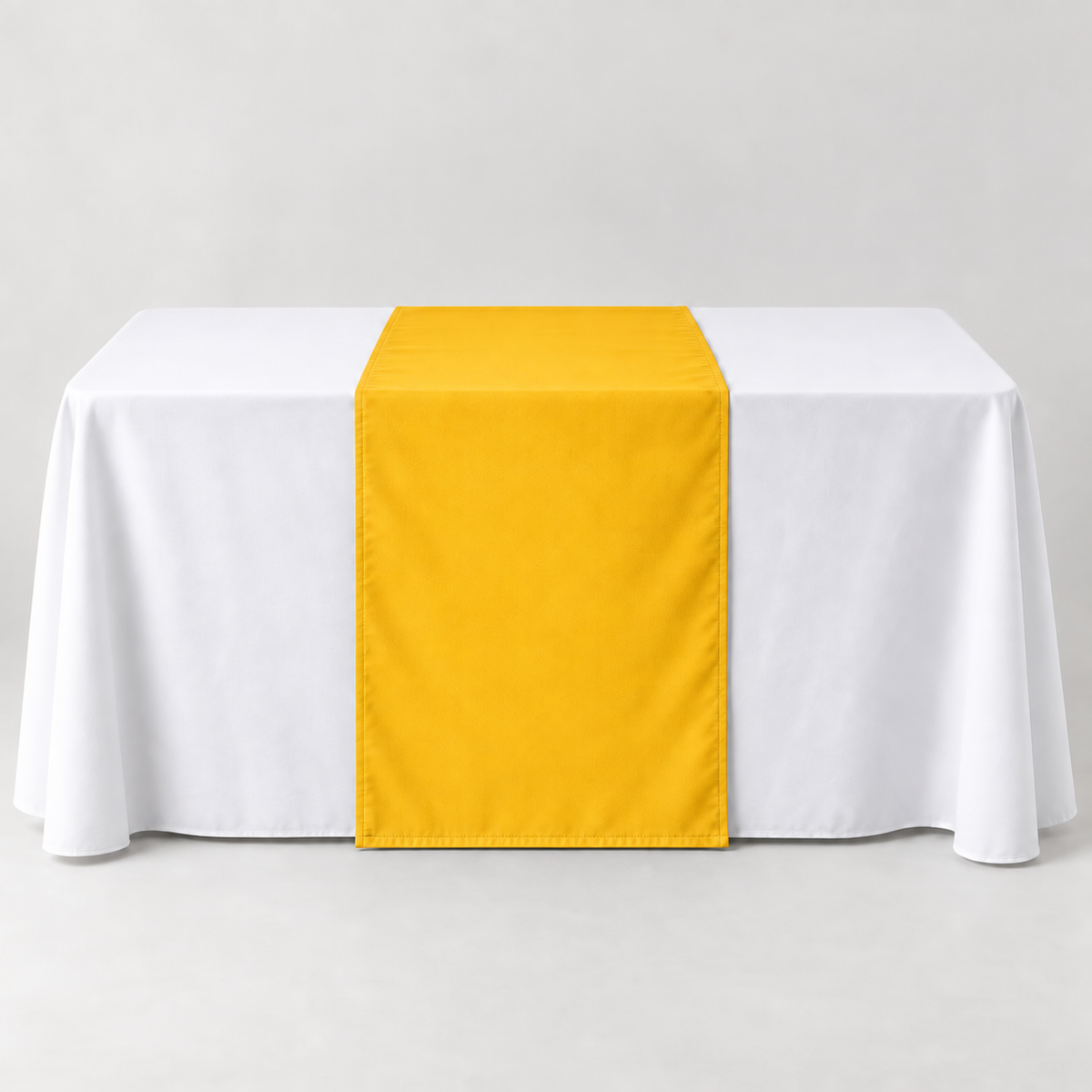 Blank Athletic Gold 30 × 60 inch table runner displayed over a white event table