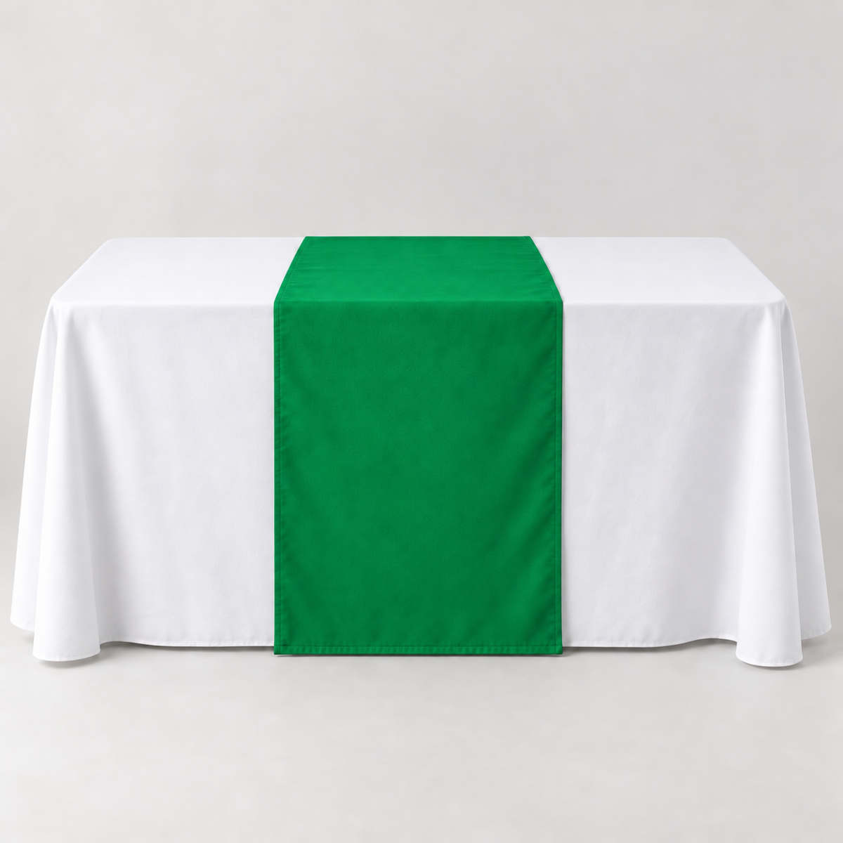 Blank Kelly Green 30 × 60 inch table runner displayed over a white event table