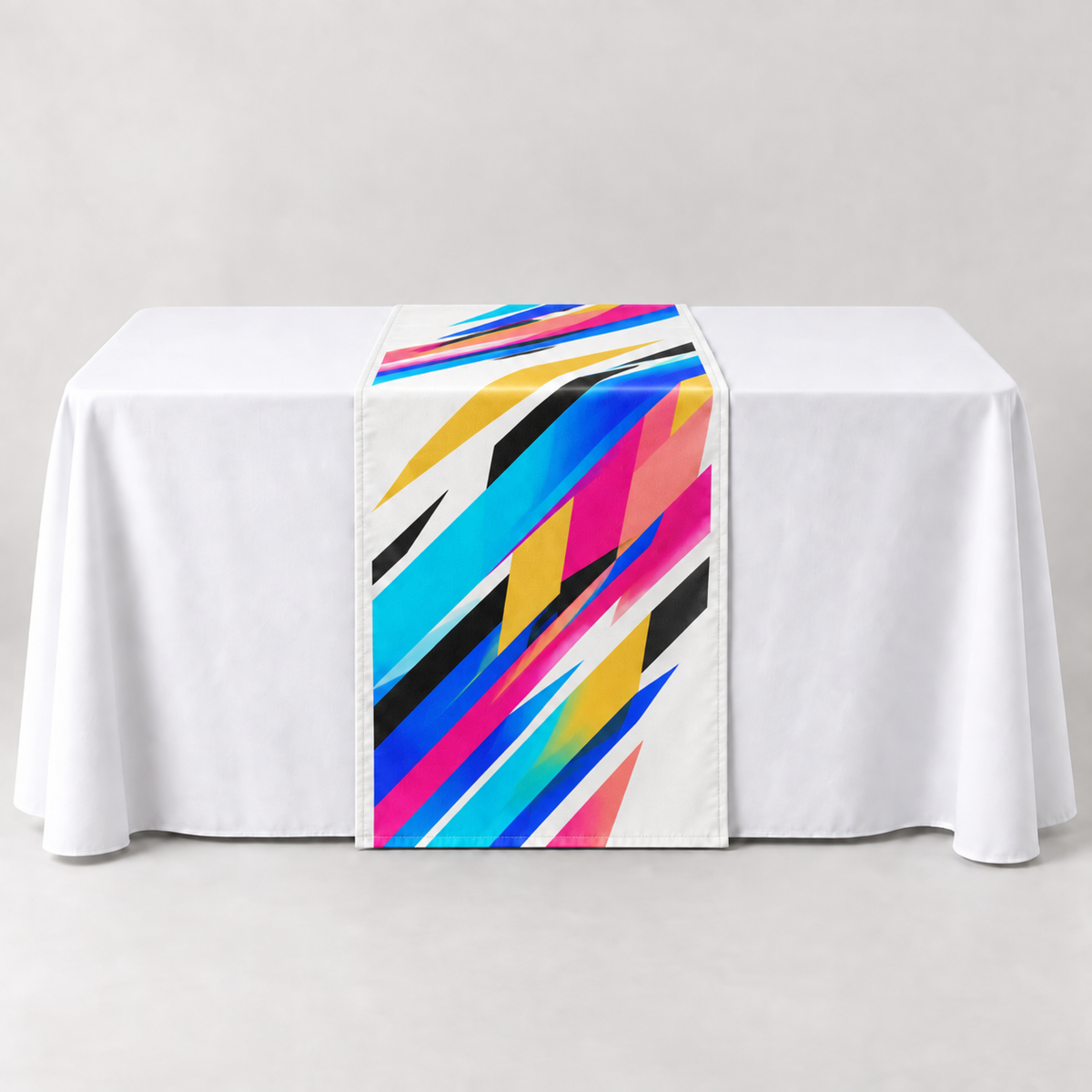Performance White 30 × 60 inch table runner with a vibrant geometric custom-print example