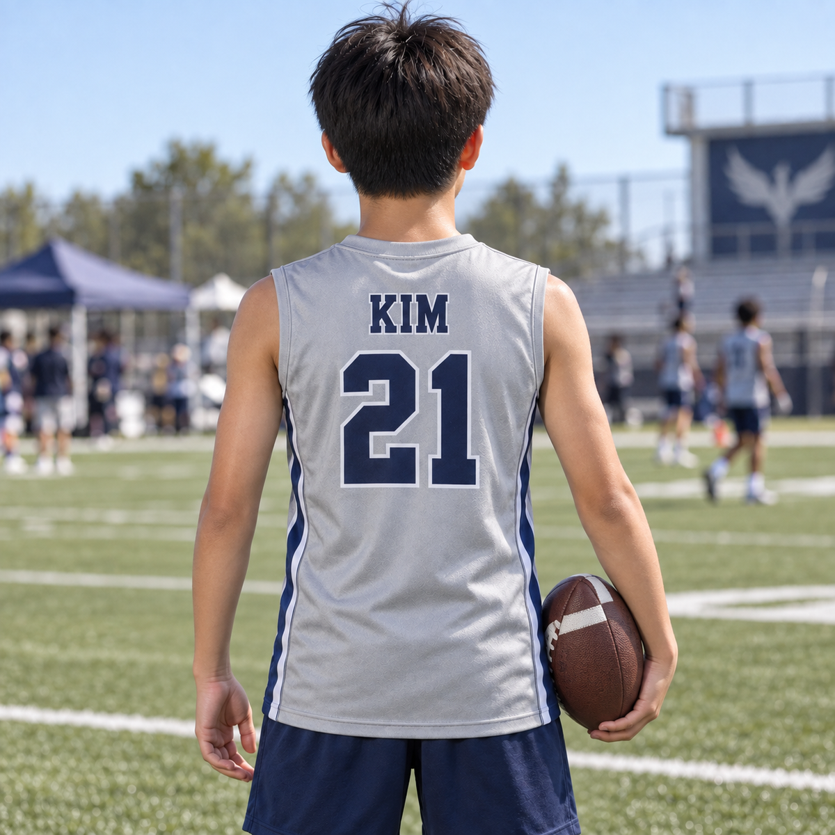 Silver custom 7-on-7 football jersey on a boy, back campaign view with KIM and number 21; AI-generated customization example