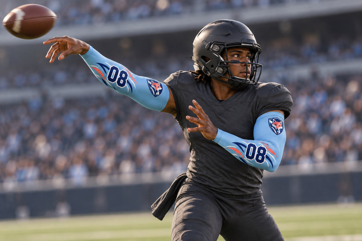 Quarterback releasing a spiral in Carolina Blue custom arm sleeves with a fox crest and number 08