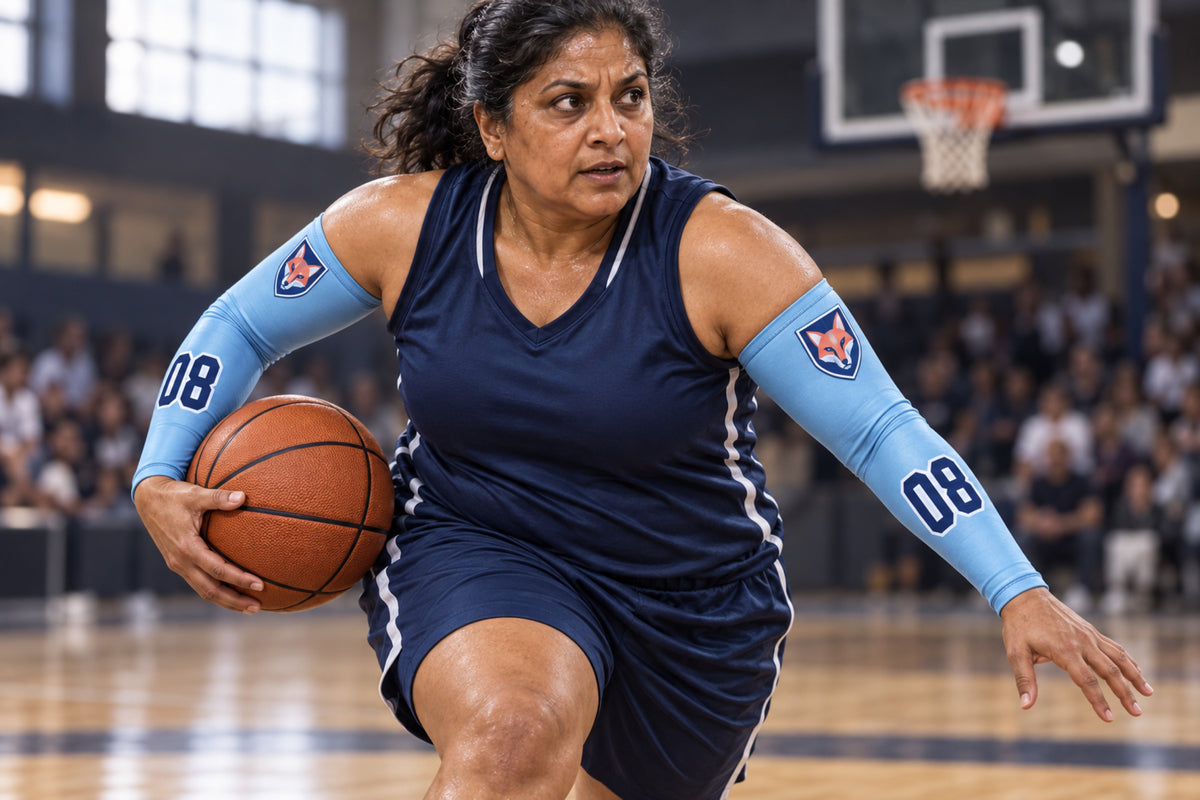 Basketball player driving to the basket in Carolina Blue custom arm sleeves with a fox crest and number 08