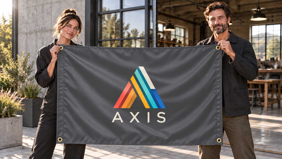 Illustrative campaign: AXIS workshop founders with a richly customized Charcoal Gray flag, 5 feet wide by 3 feet tall, four metal corner grommets and reinforced side bands.