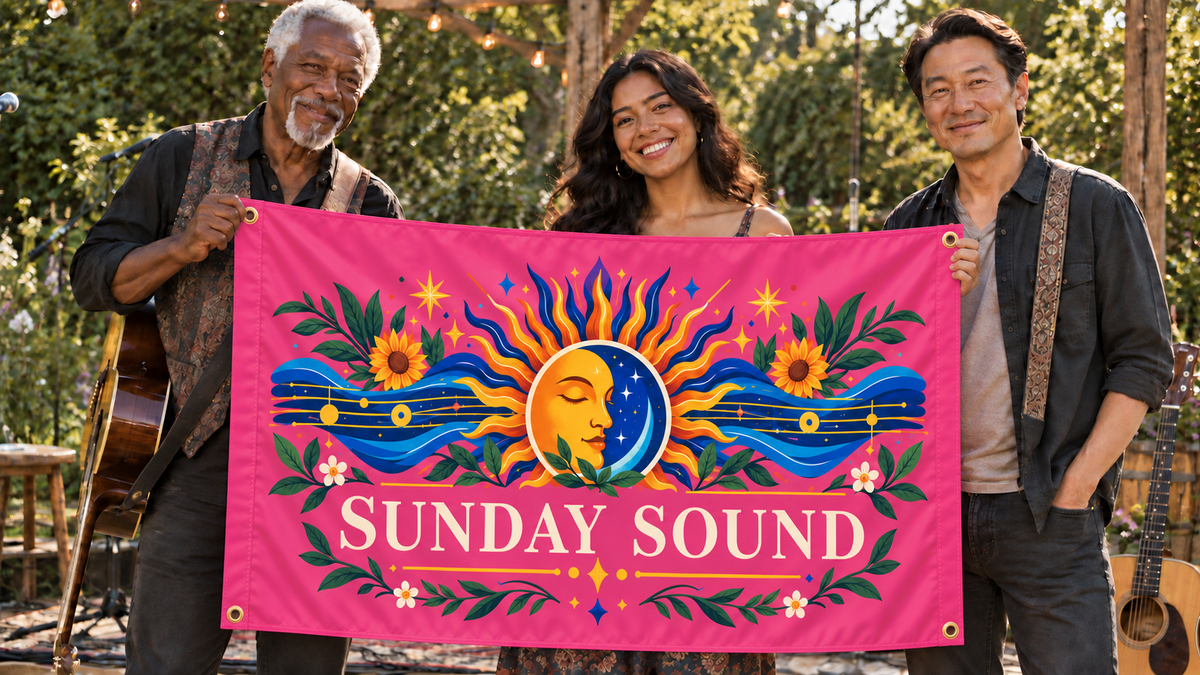 Pink customized 5 ft x 3 ft flag at a music event, with colorful original artwork, people, four corner grommets and matching stitched side bands
