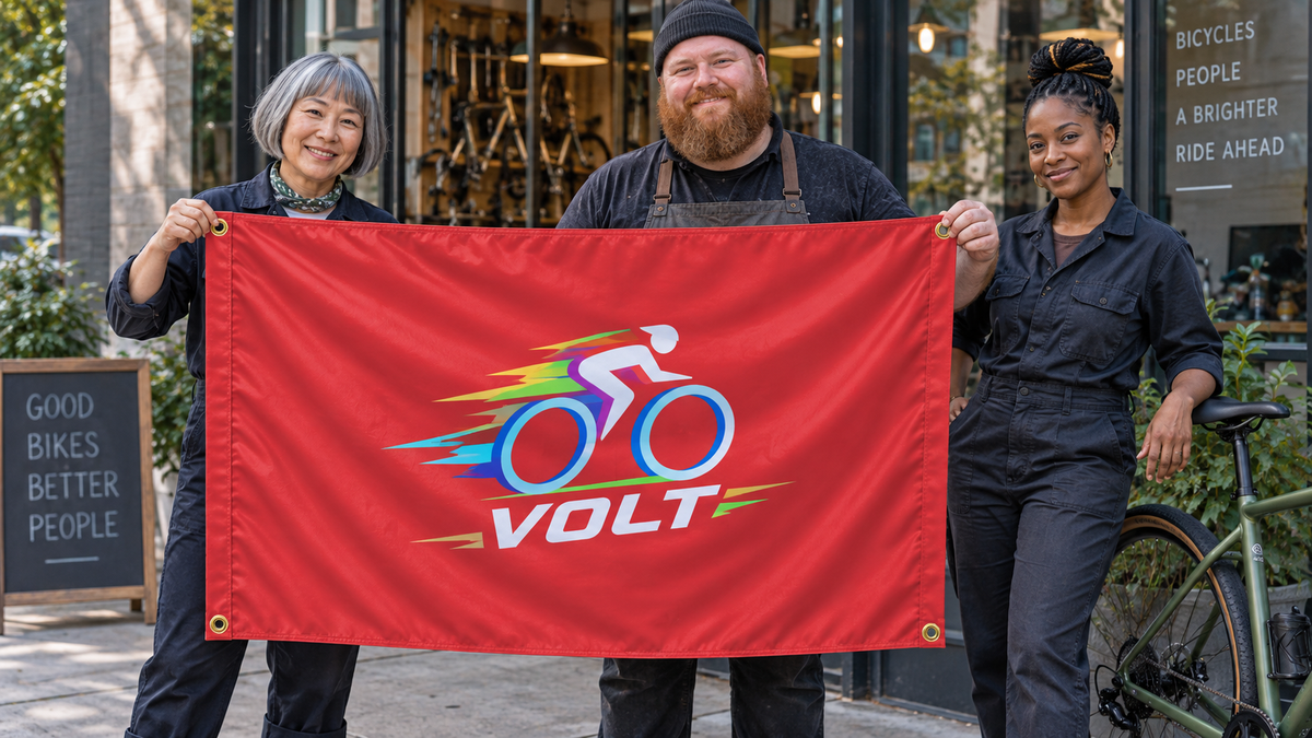 Illustrative campaign: VOLT bicycle shop team with a richly customized Red flag, 5 feet wide by 3 feet tall, four metal corner grommets and reinforced side bands.