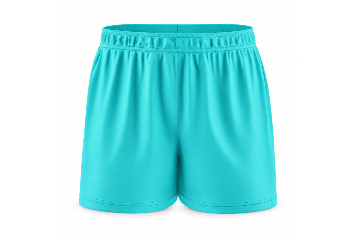Front view of blank turquoise custom sublimated athletic shorts with elastic waistband and stitched hems on a white background.